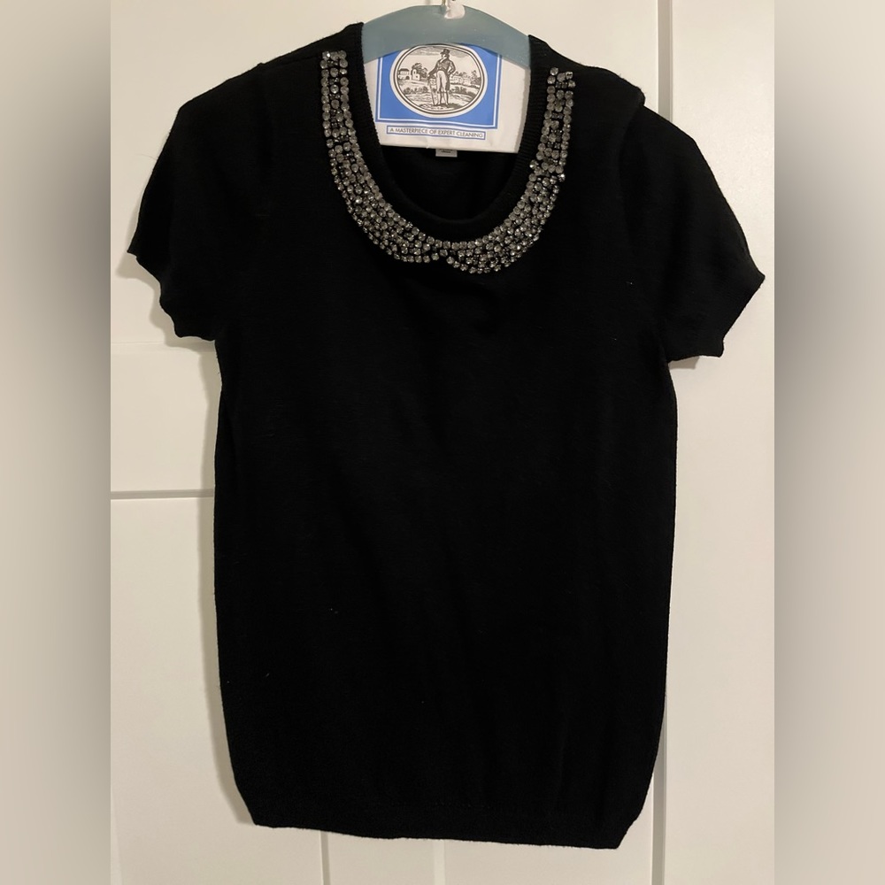 Black short sleeve sweater with sparkle detail.